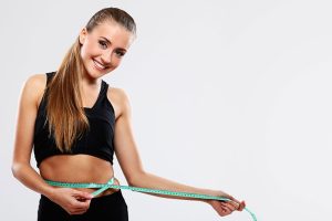 young-woman-measuring-her-waist-1
